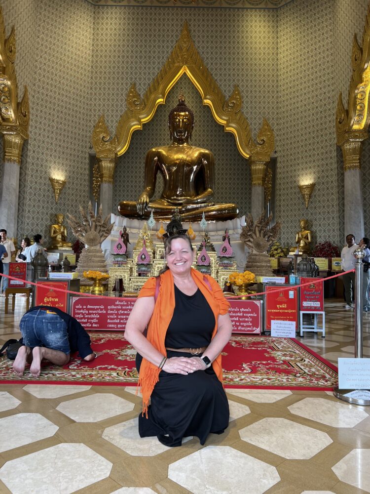 SE Asia Cruise: Packing Tips and List | The Common Traveler | image: woman at Buddhist temple