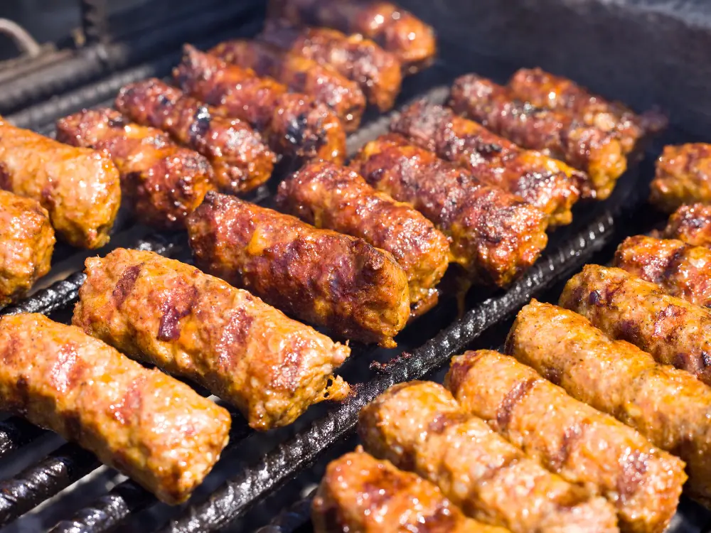 Macedonian Foods to Try | The Common Traveler | image: small meat sausages on a grill