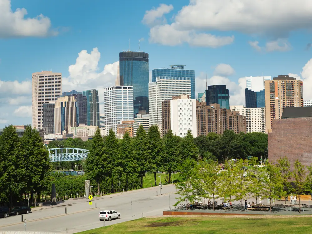 Best Things to Do in Downtown Minneapolis | The Common Traveler | image: Walker Center in front of Minneapolis skyline