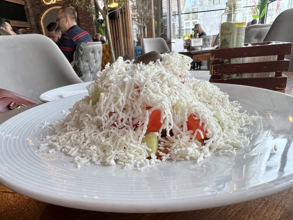 Macedonian Foods to Try | The Common Traveler | image: Serene cheese covering shopska salad