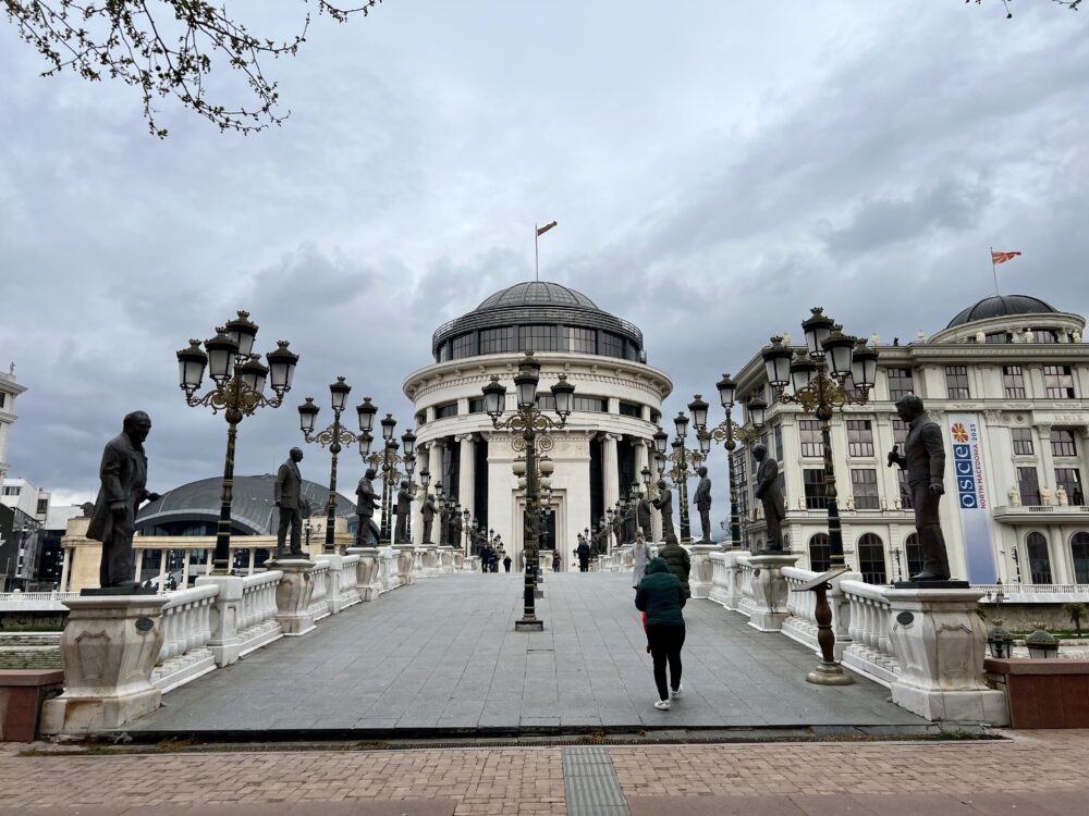 Best Things to Do in Skopje | The Common Traveler | image: bridge with statues of academics