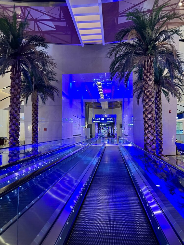 24 Hours in Bahrain Itinerary | The Common Traveler | image: lit up walkway at Bahrain International Airport