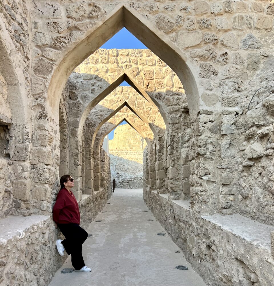 24 Hours in Bahrain Itinerary | The Common Traveler | image: woman at Bahrain Fort