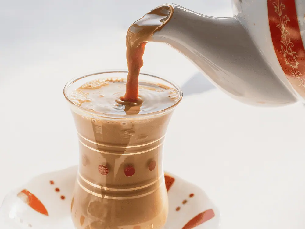 24 Hours in Bahrain Itinerary | The Common Traveler | image: karak tea being poured into a glass