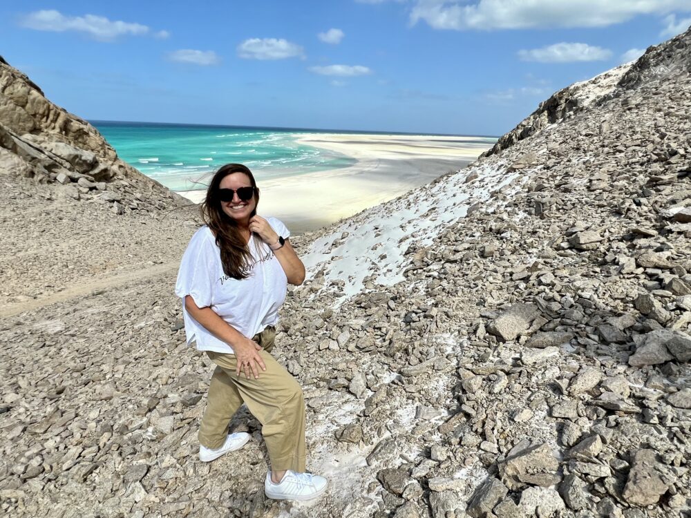 Middle East Packing List for Women | The Common Traveler | image: woman in front beach in Socotra