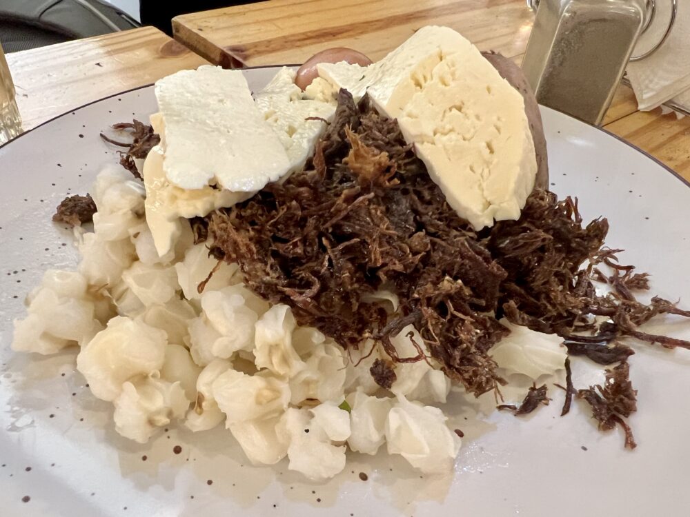 Traditional Bolivian Foods to Try | The Common Traveler | image: plate of charqueka