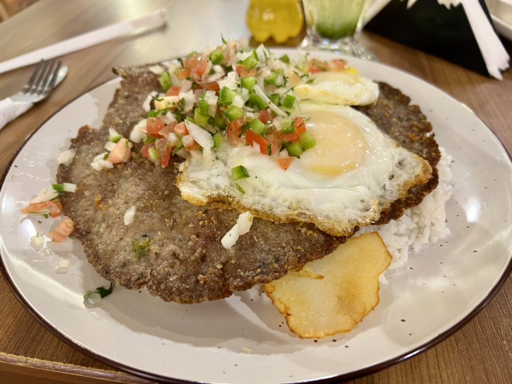 Traditional Bolivian Foods to Try | The Common Traveler | image: plate of silpancho