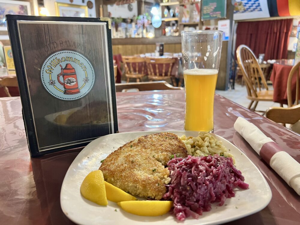 28 Best Things to Do in Helen, GA | The Common Traveler | image: plate of Schnitzel with a beer