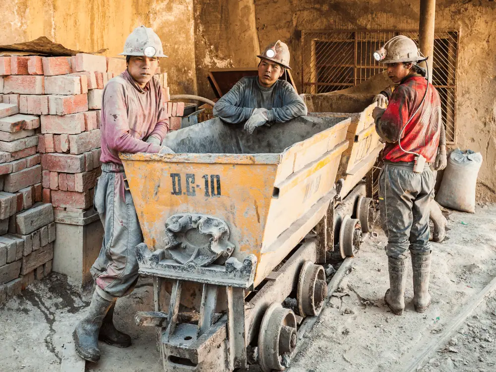 Bolivia Souvenirs | The Common Traveler | image: three miners in silver mine in Potosi