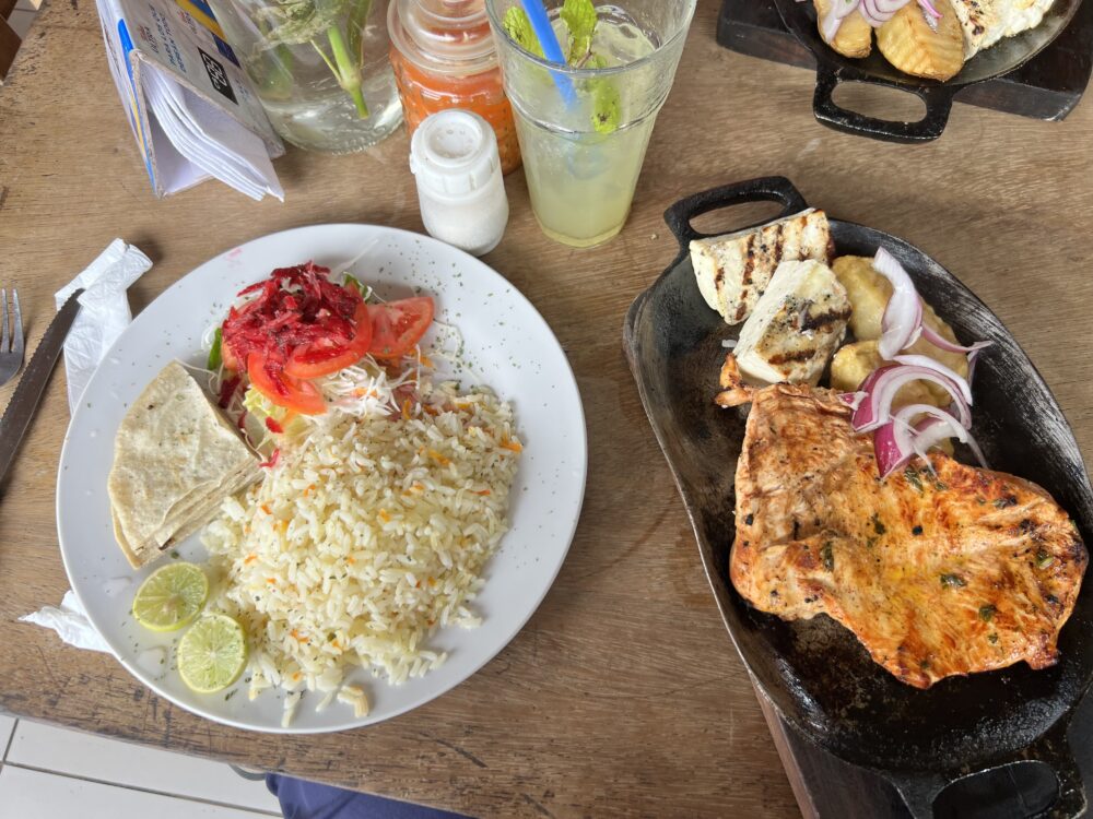 Managua, Nicaragua | The Common Traveler | image: rice plate and grilled chicken on table