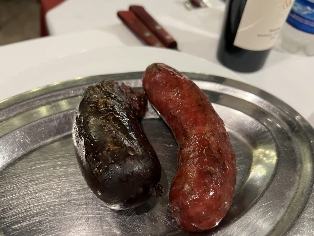 Best Foods and Drinks to Try in Argentina | The Common Traveler | image: blood sausage and chorizo on silver plate