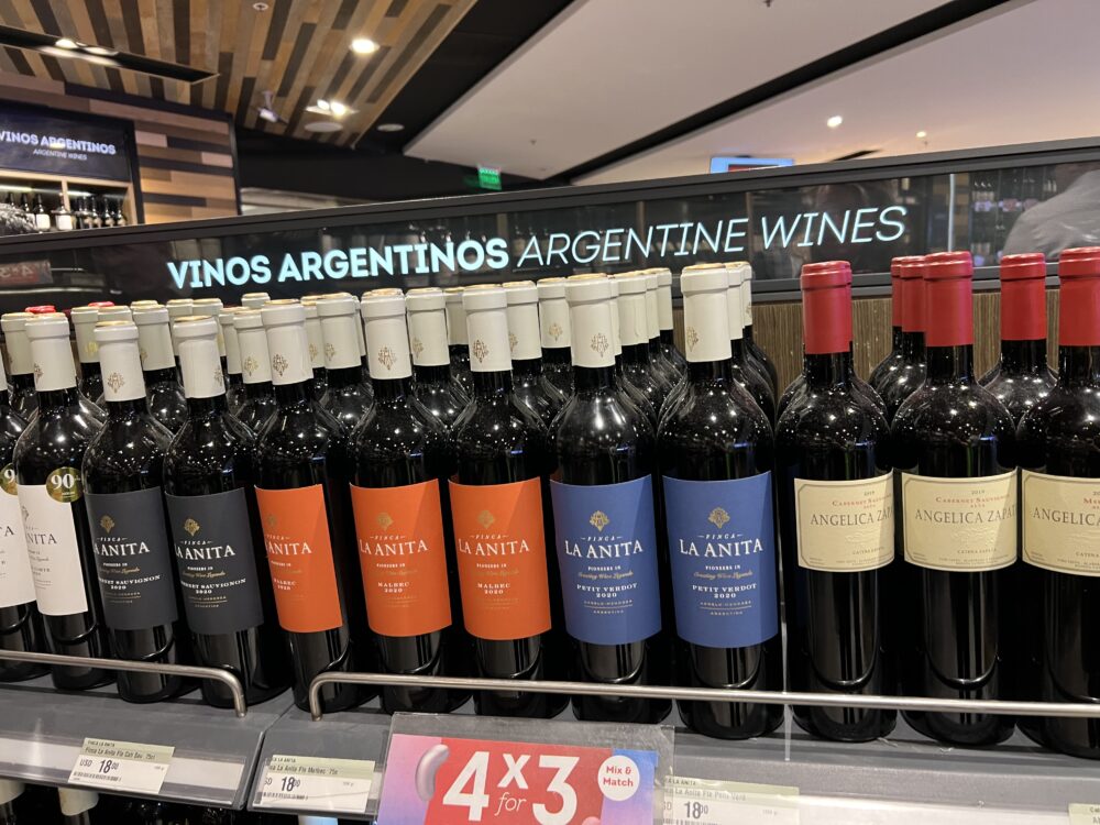 Best Foods and Drinks to Try in Argentina | The Common Traveler | image: rows of red argentine wines