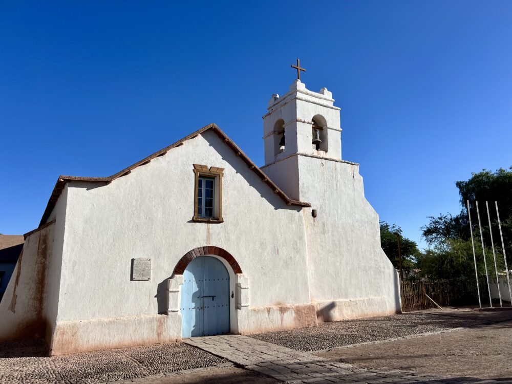 San Pedro de Atacama | The Common Traveler | image: white colonial church with blue doors