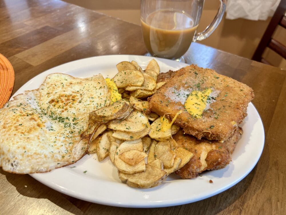 28 Best Things to Do in Helen, GA | The Common Traveler | image: plate of fried cheese, eggs, and potatoes