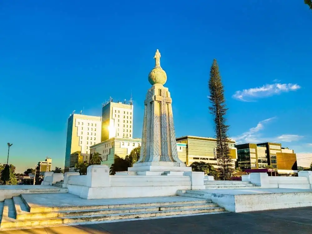 What to Do in San Salvador | The Common Traveler | image: sunrise at Plaza Salvador del Mundo - Jesus Christ on top of globe statue