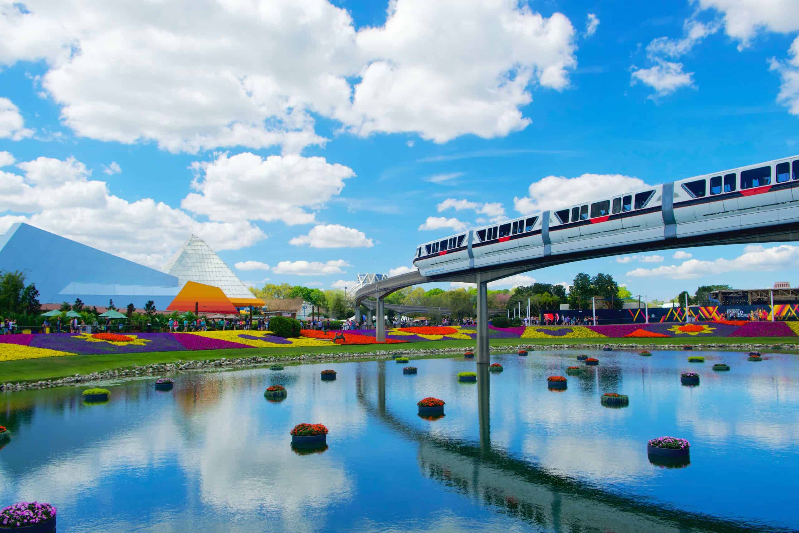Money Saving Tips for Family Adventures | The Common Traveler | image: monorail reflecting over lake underneath
