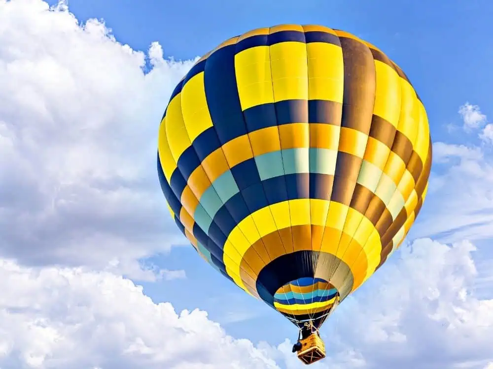 28 Best Things to Do in Helen, GA | The Common Traveler | image: yellow and brown balloon in the air