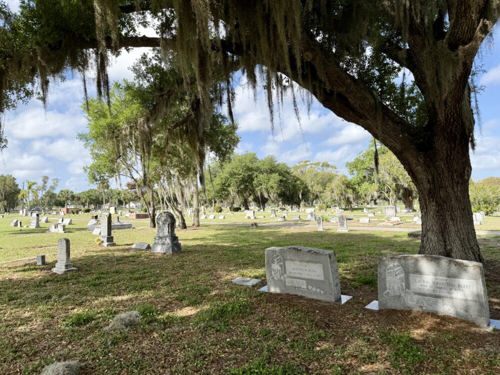 Haunted Fort Myers | The Common Traveler | image: trees and tombs in Fort Myers City Cemetery