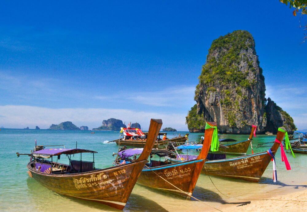 Relaxing Thailand Itinerary | The Common Traveler | image: wooden boats on shore at Krabi