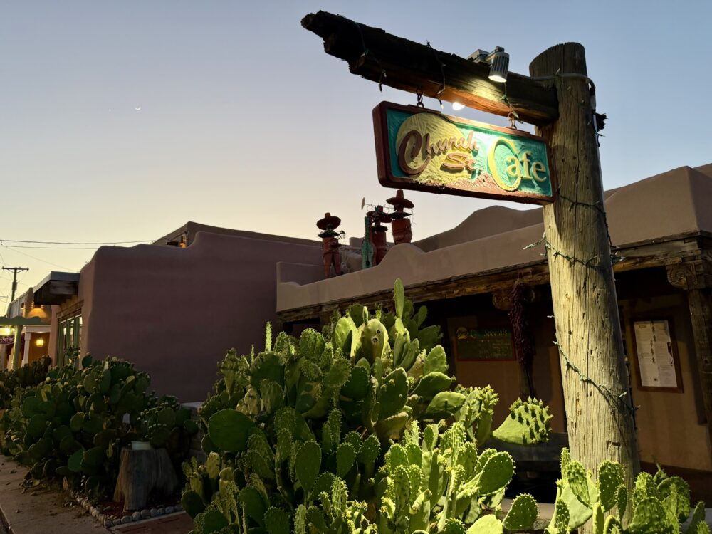 Haunted Albuquerque | The Common Traveler | image: Church Street Cafe sign in front of adobe building
