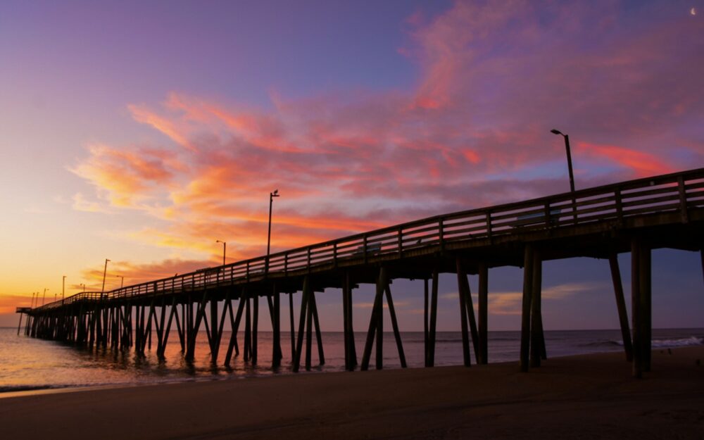 Ghost Tour in Virginia Beach | The Common Traveler | image: sunrise on wooden pier in Virginia Beach
