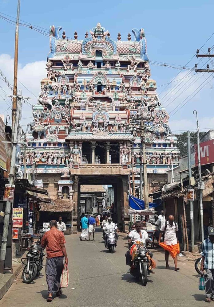 Unique Places to Visit in India | The Common Traveler | image: colorful temple in Trichy with motorcycles in front