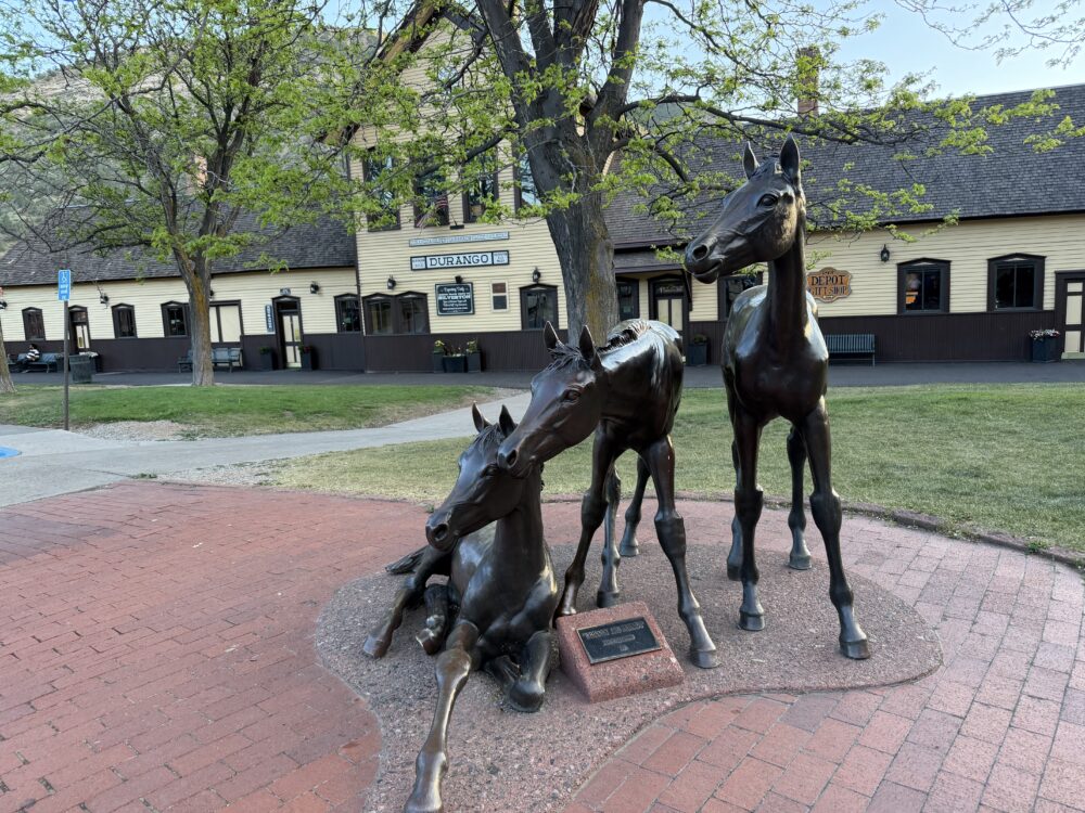 Durango, Colorado: Your Complete Guide | The Common Traveler | image: horse statues in front of Durango yellow train depot