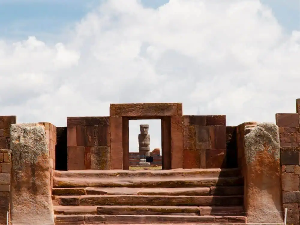 Gringo Trail in Bolivia: 5 Places to Escape the Usual Tourist Route | The Common Traveler | image: red rock historic statue in Tiwanaku