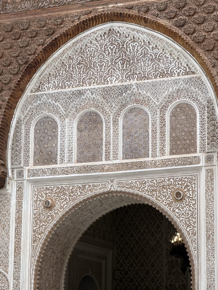 Why December Might Be the Best Time to Visit Marrakech | The Common Traveler | image: intricate work on entrance at Almoravid Koubba